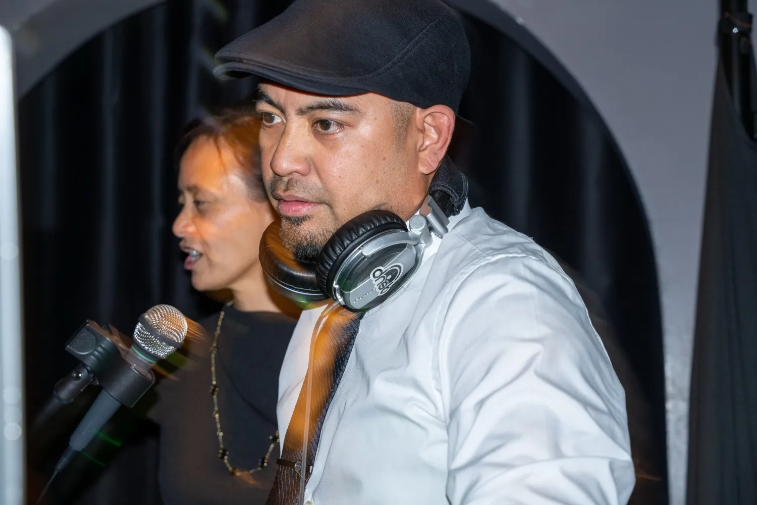 Dennis at the DJ booth with Michele beside him